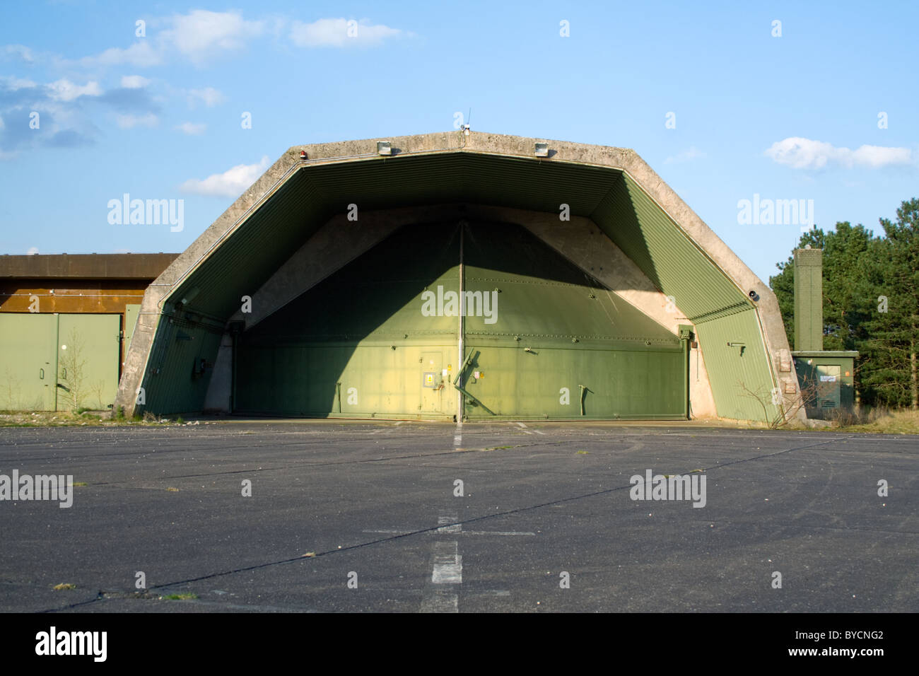 Abandoned aircraft hardened shelter on the former RAF Laarbruch base in Germany. Now a civilian airport called Dusseldorf-Weeze. Stock Photo