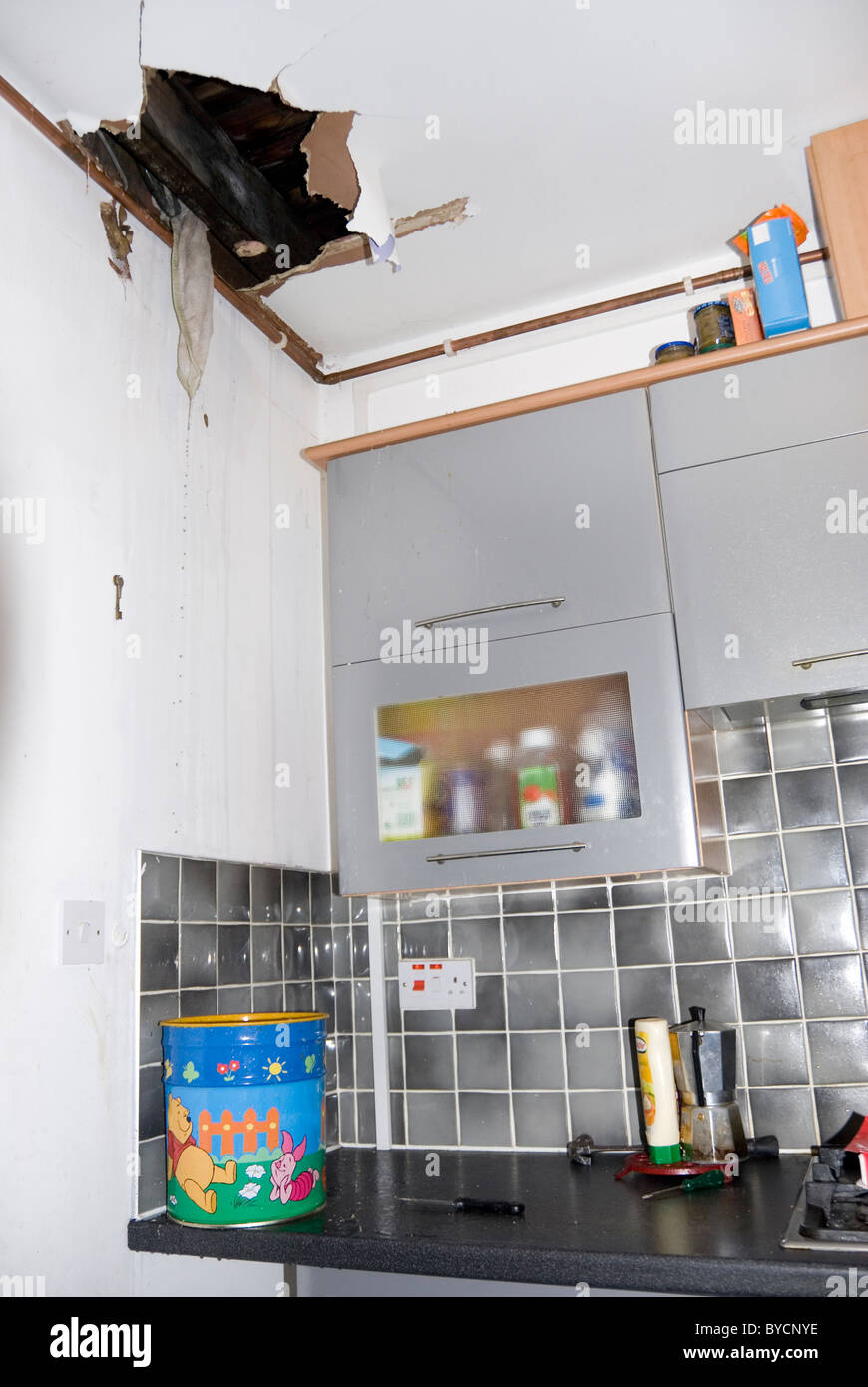 Big Torn Hole In Kitchen Ceiling And Water Leaking From Burst Pipe