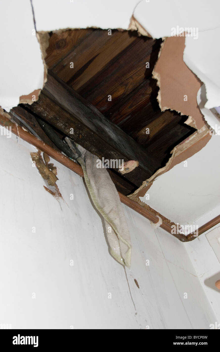 Close Up Of Big Torn Hole In Kitchen Ceiling And Water Leaking From BYCP0W 