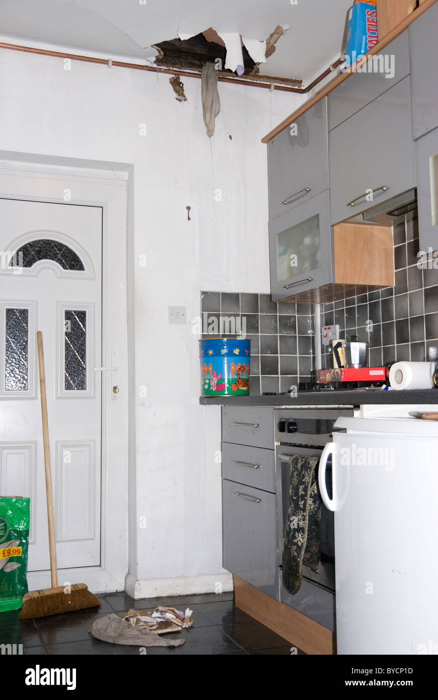 Big Torn Hole In Kitchen Ceiling And Water Leaking From Burst Pipe