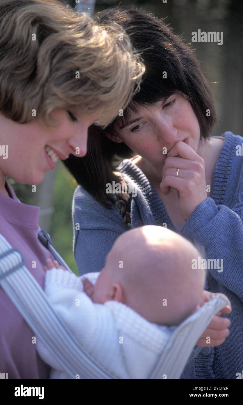 woman jealous of another's baby Stock Photo