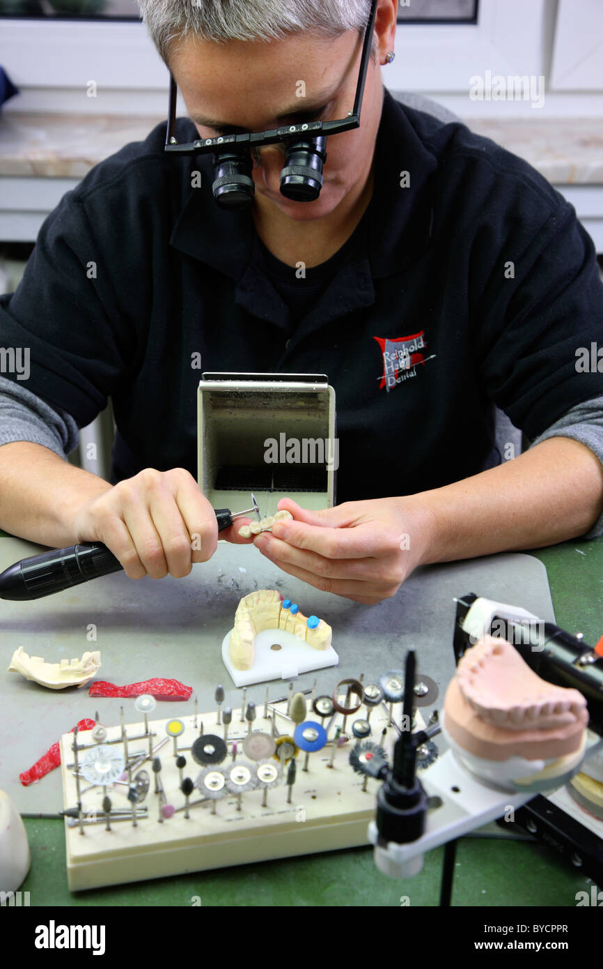 Dental laboratory, dental technician at work, making of tooth bridges