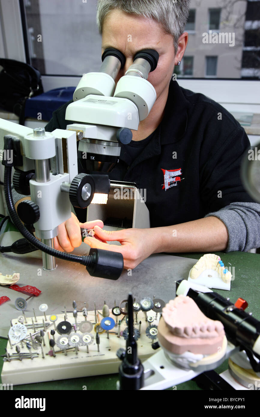 Dental laboratory, dental technician at work, making of tooth bridges