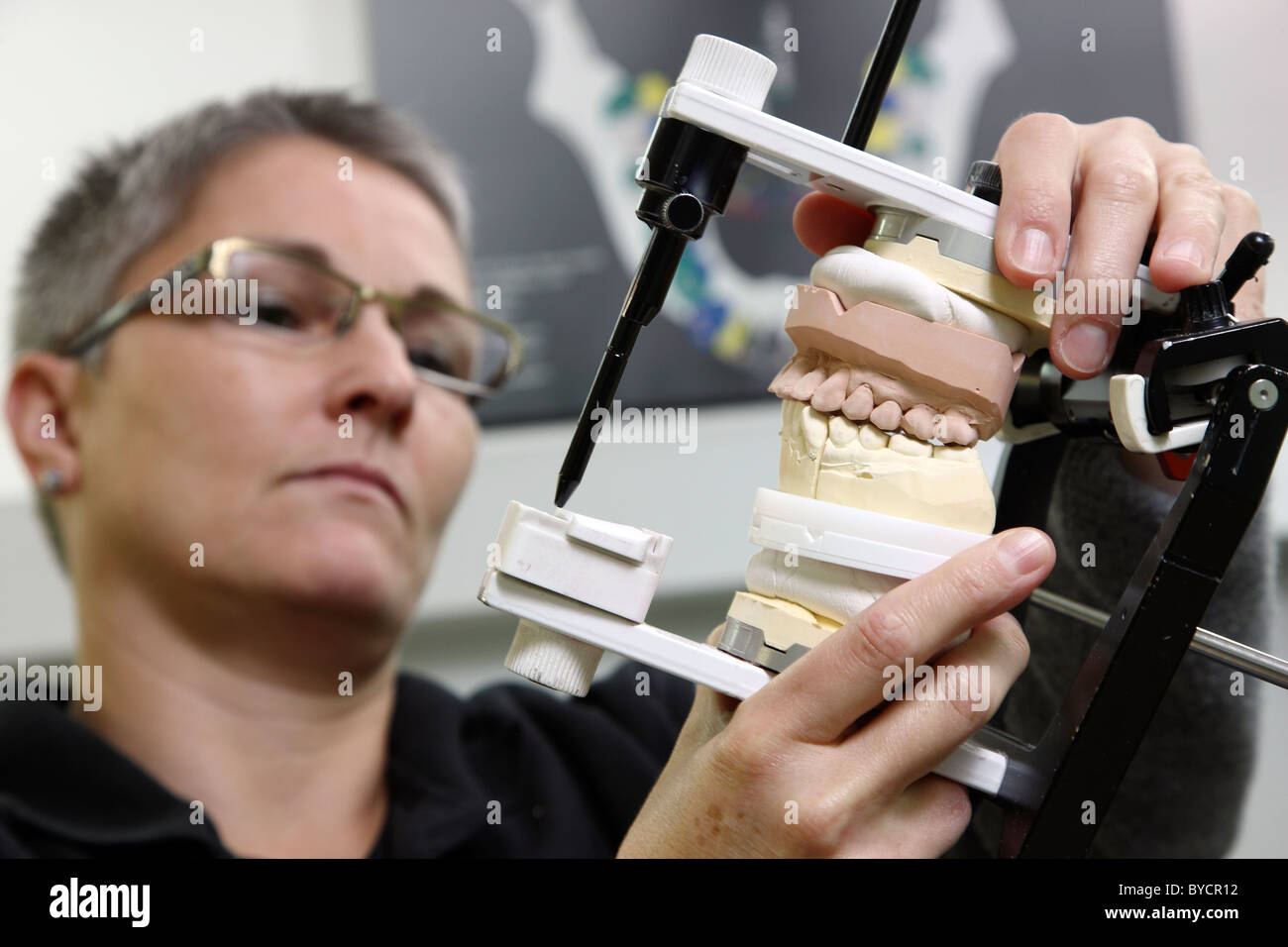 Dental laboratory, dental technician at work, making of tooth bridges