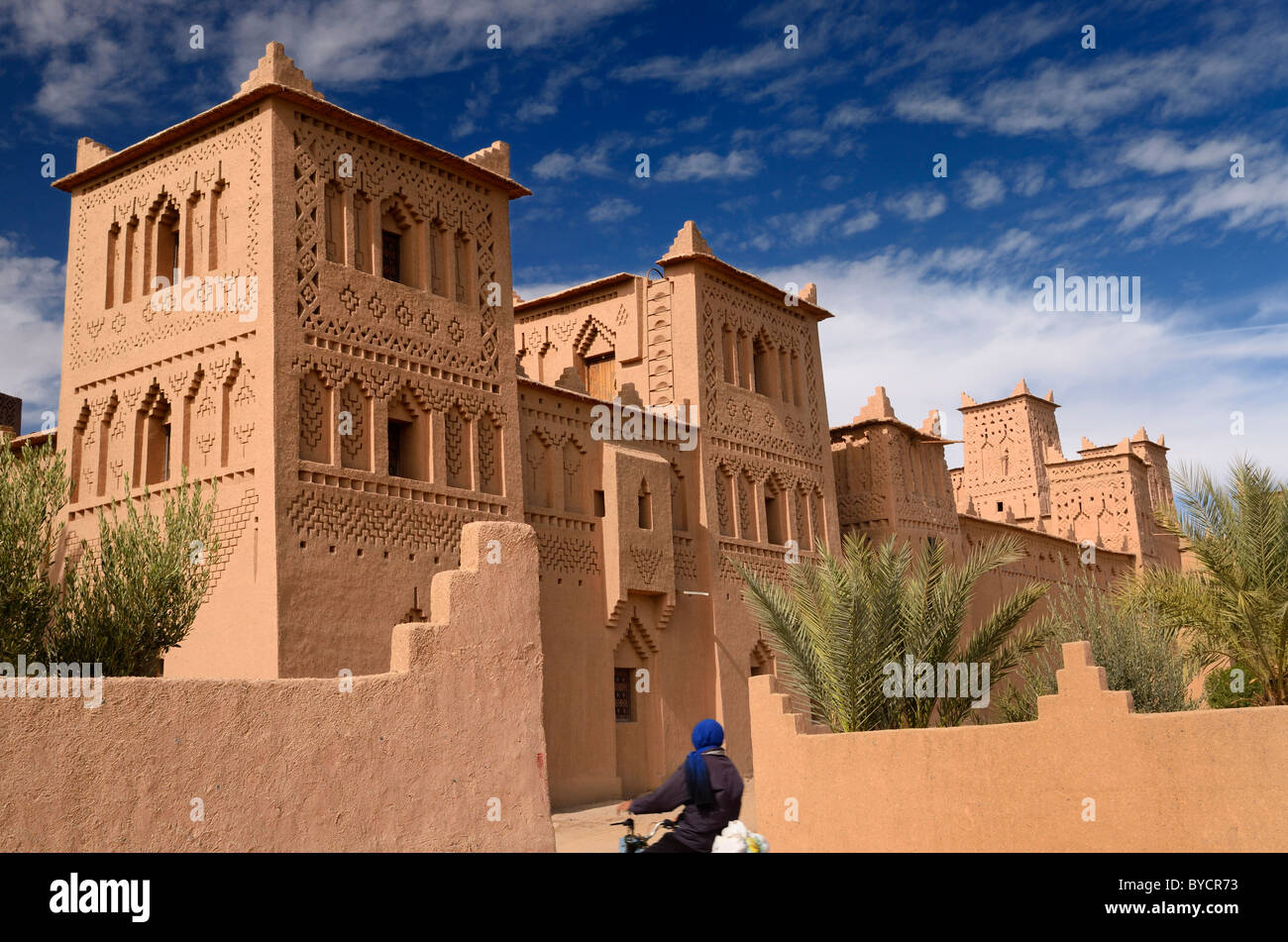 Refurbished towers of the ancient heritage site Kasbah Amerhidl ochre earth fortress in the Skoura oasis Morocco Stock Photo