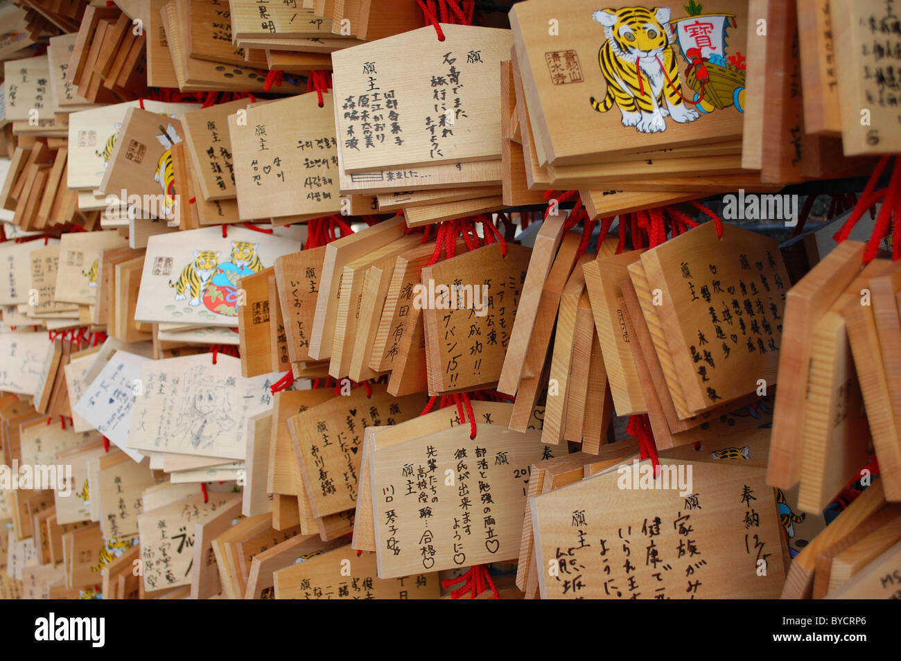 Prayers, wishes and hopes written in Japanese and hung at a shrine in