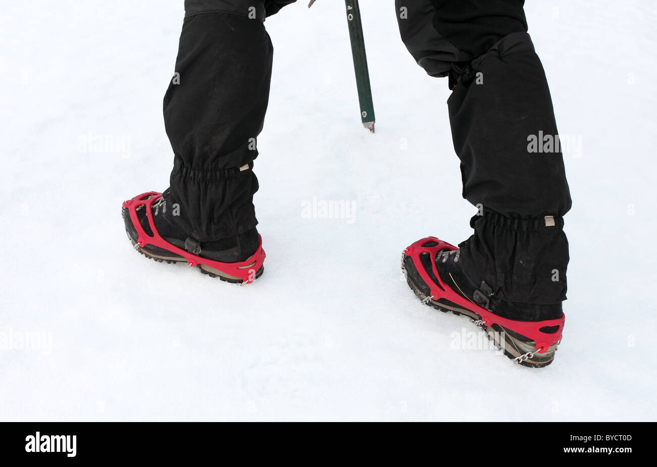 Close up View of a Pair of Kathoola Microspike Crampons in Use on Snow UK Stock Photo