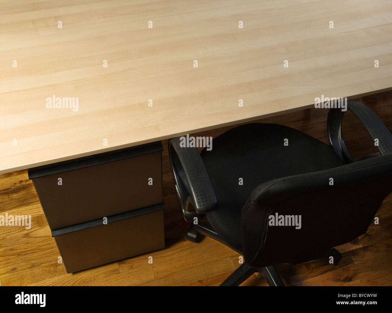 Overhead View Of Empty Desk With Chair And File Cabinet Stock