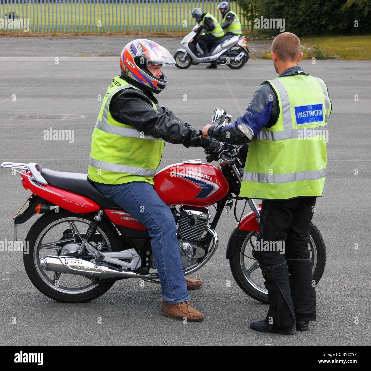 A young learner riding on a 125cc or 50cc motor bike on his CBT training day taking his test Stock Photo