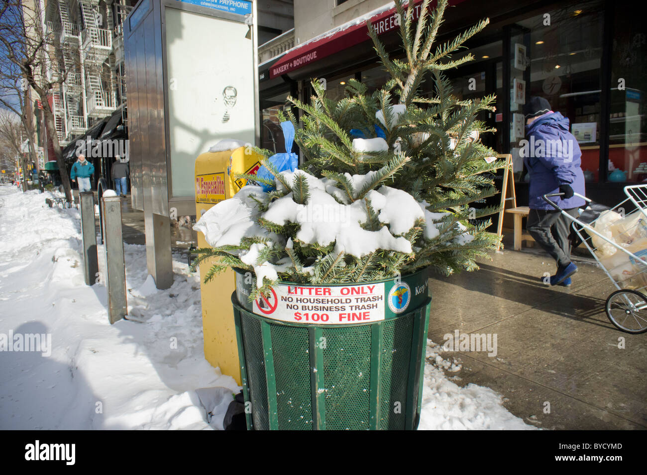An overflowing trash can is seen in the New York neighborhood of Chelsea Stock Photo