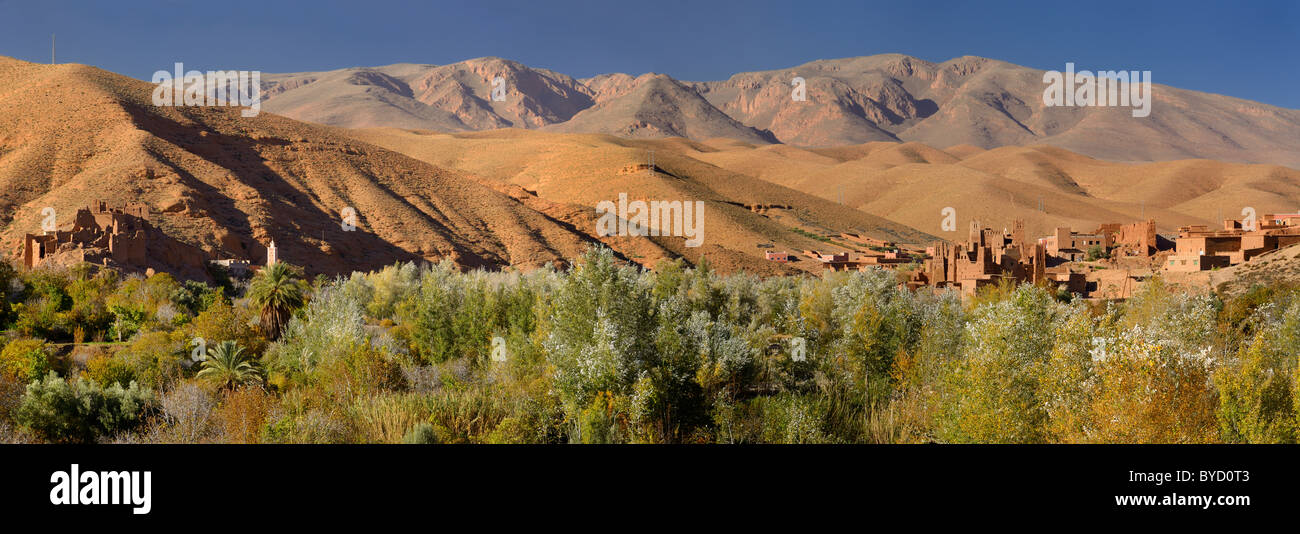 Panorama with red Ait Arbi Kasbah ruins along the Dades Gorge river of the High Atlas mountains Morocco Stock Photo