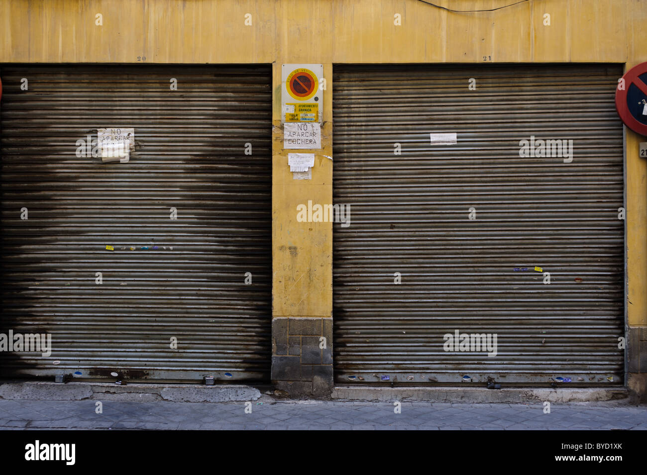No parking outside garages in Granada, Spain Stock Photo Alamy