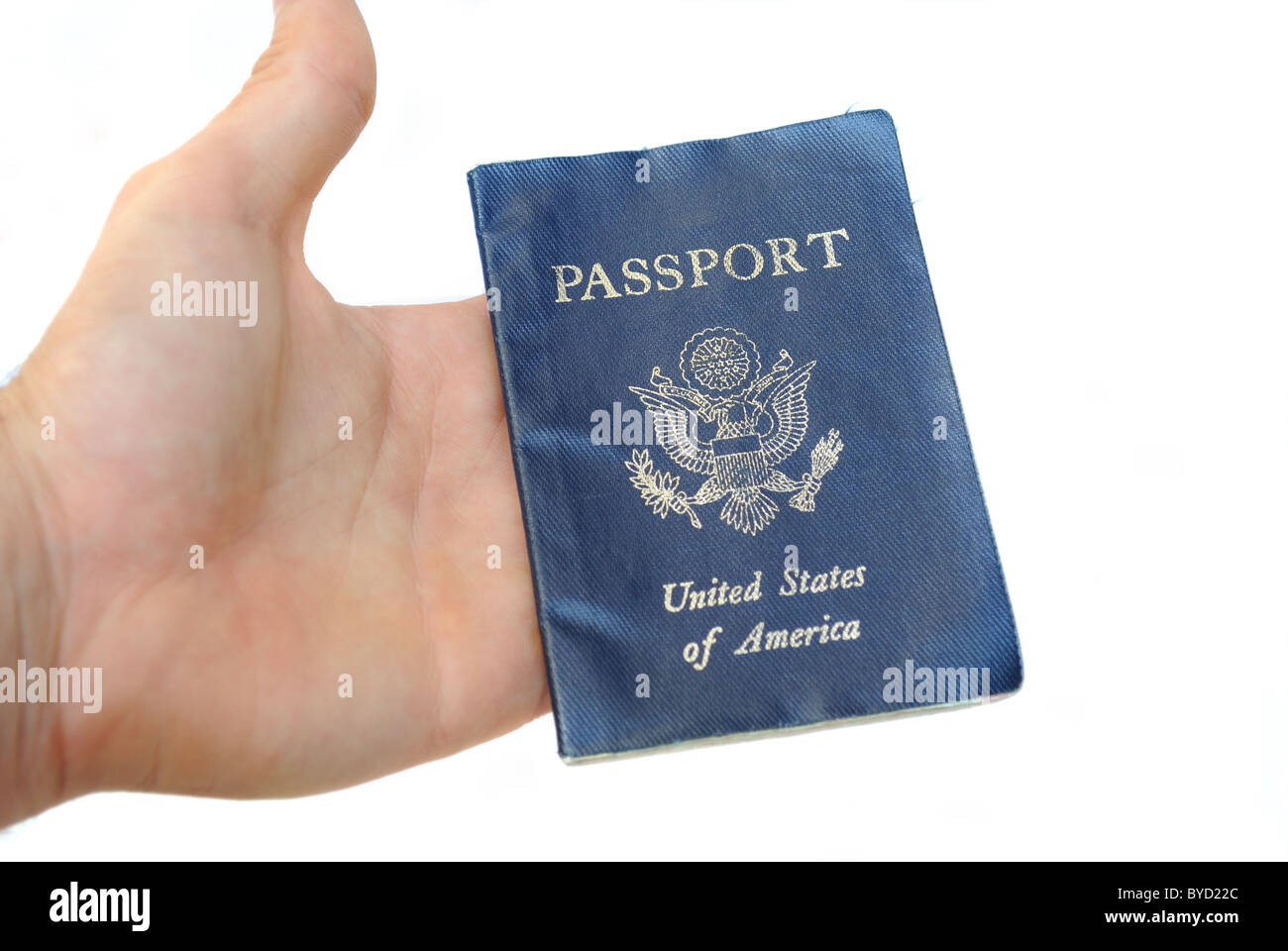 Passport being held in hand isolated Stock Photo Alamy