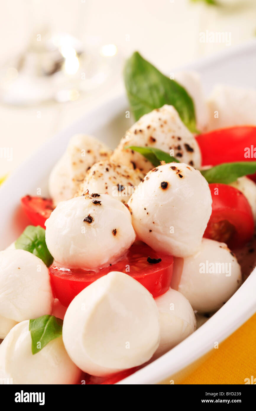Bowl of mozzarella cheese, tomato and basil Stock Photo - Alamy