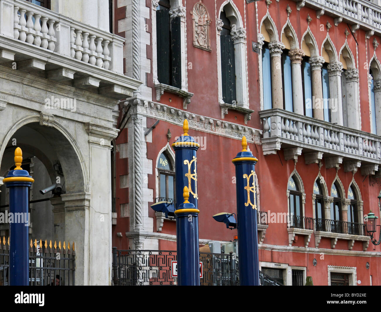 Colourful mooring posts for water taxis in Venice Stock Photo