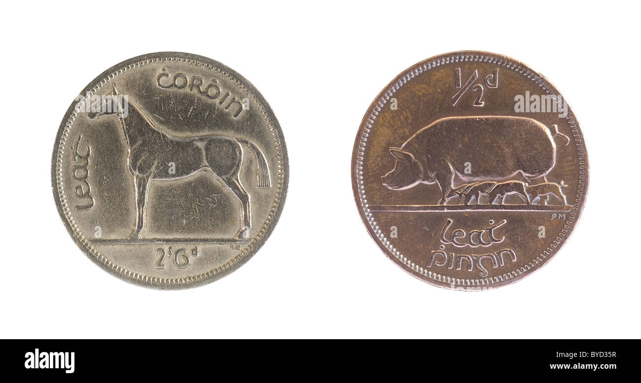 Reverse sides of two pre decimal Irish coins showing horse and pig Stock Photo