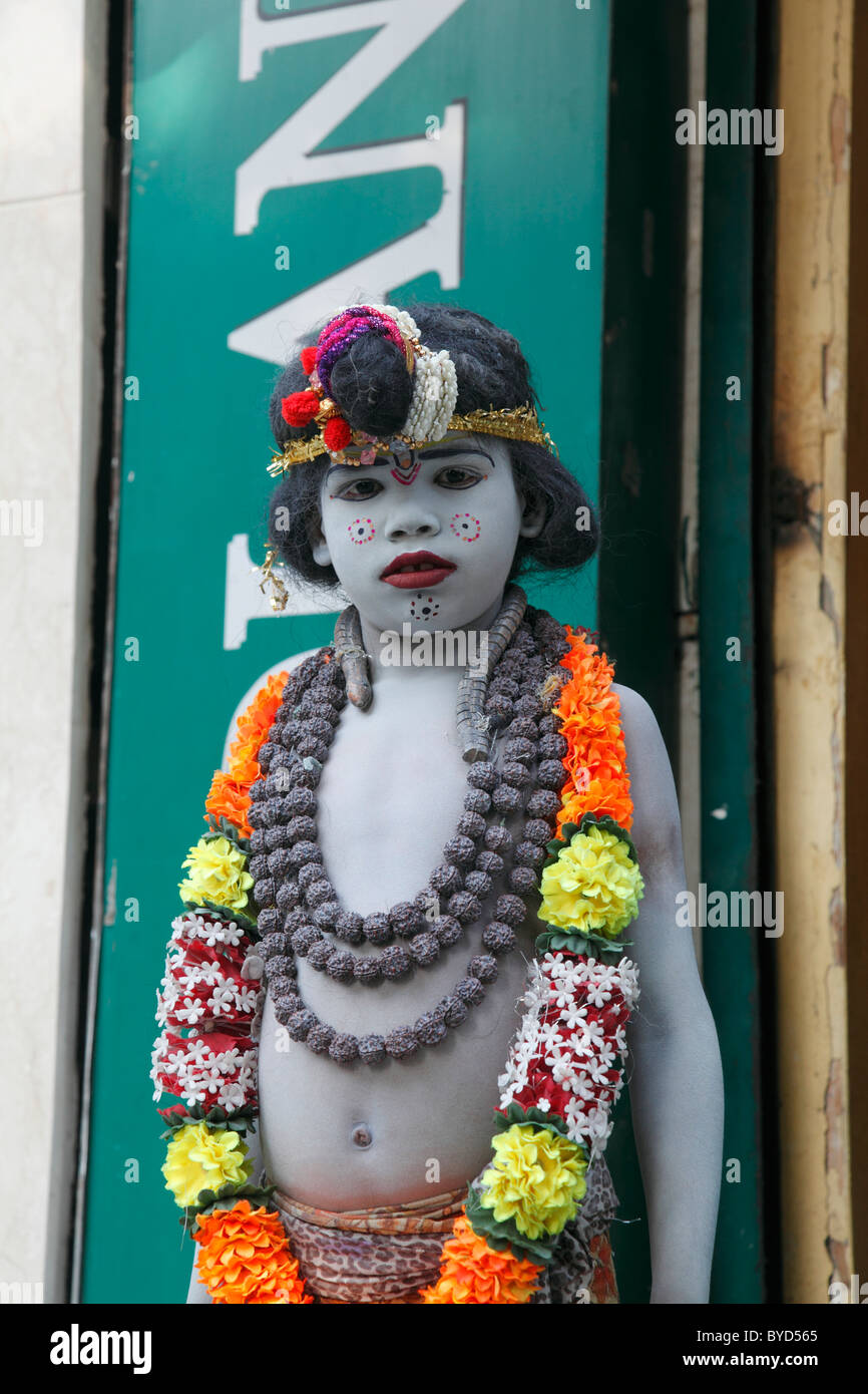 A child dressed as Lord Krishna going begging, Delhi, Uttar ...