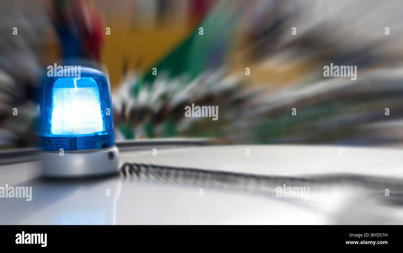 A police car cars with blue lights flashing hires stock photography
