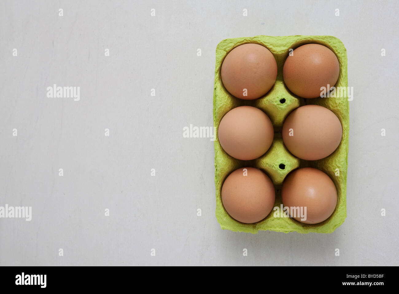 Six brown eggs in an egg carton Stock Photo