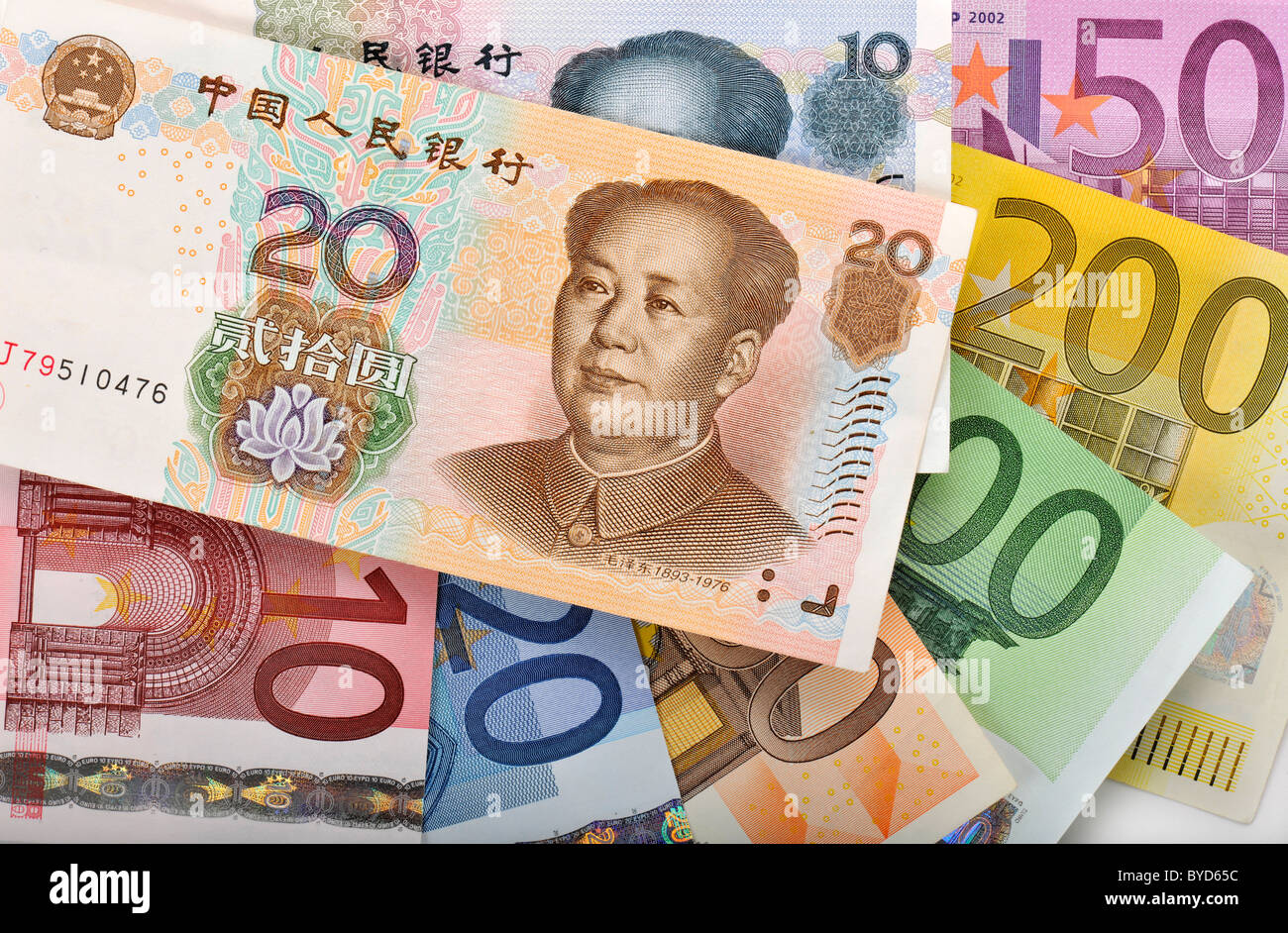 Fan of various euro banknotes and Chinese yuan banknotes, renminbi, the currency of the People's Republic of China, known in the Stock Photo