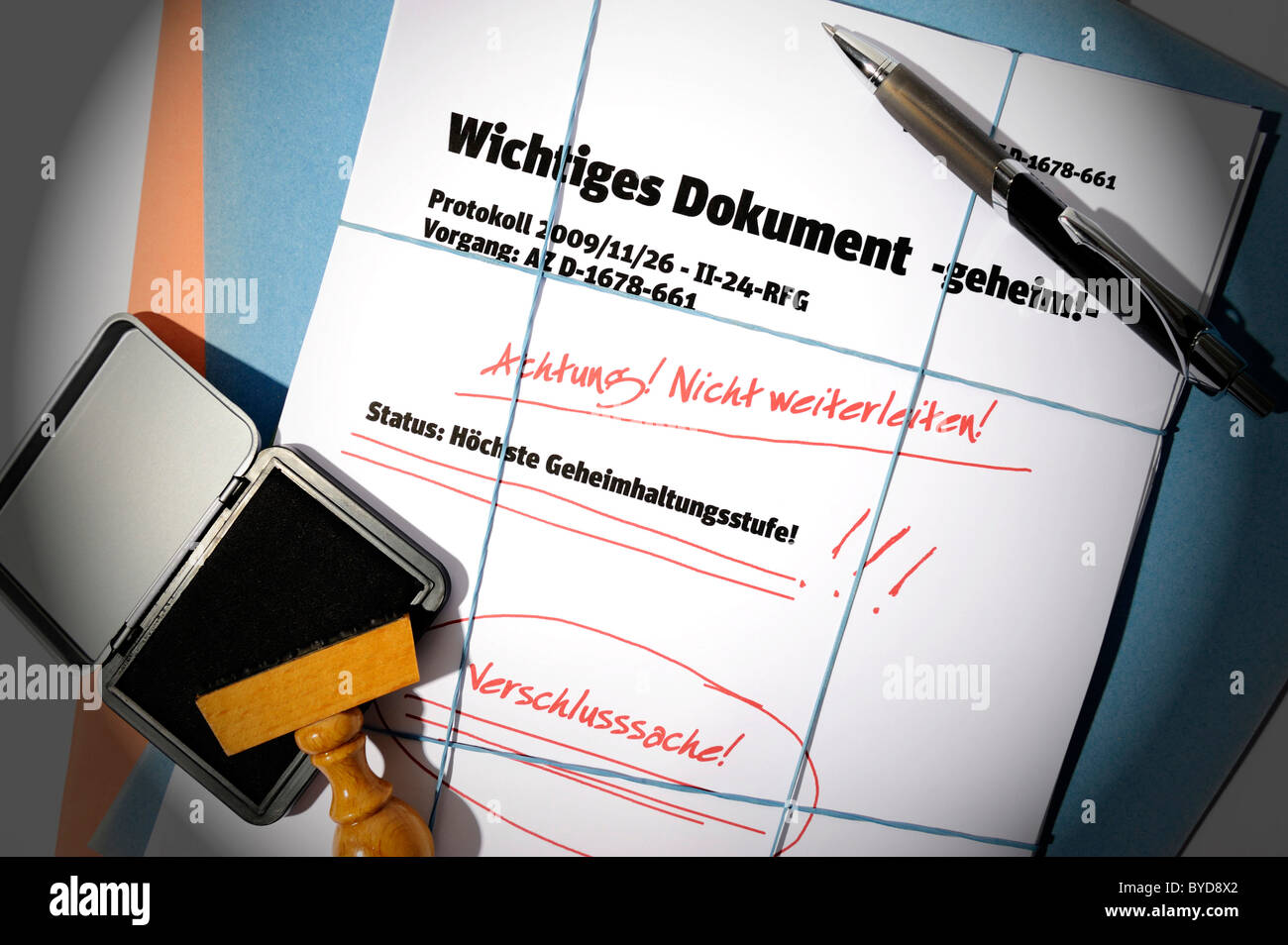 Papers, lettering 'Wichtiges Dokument', German for 'important document', symbolic image for secret documents Stock Photo