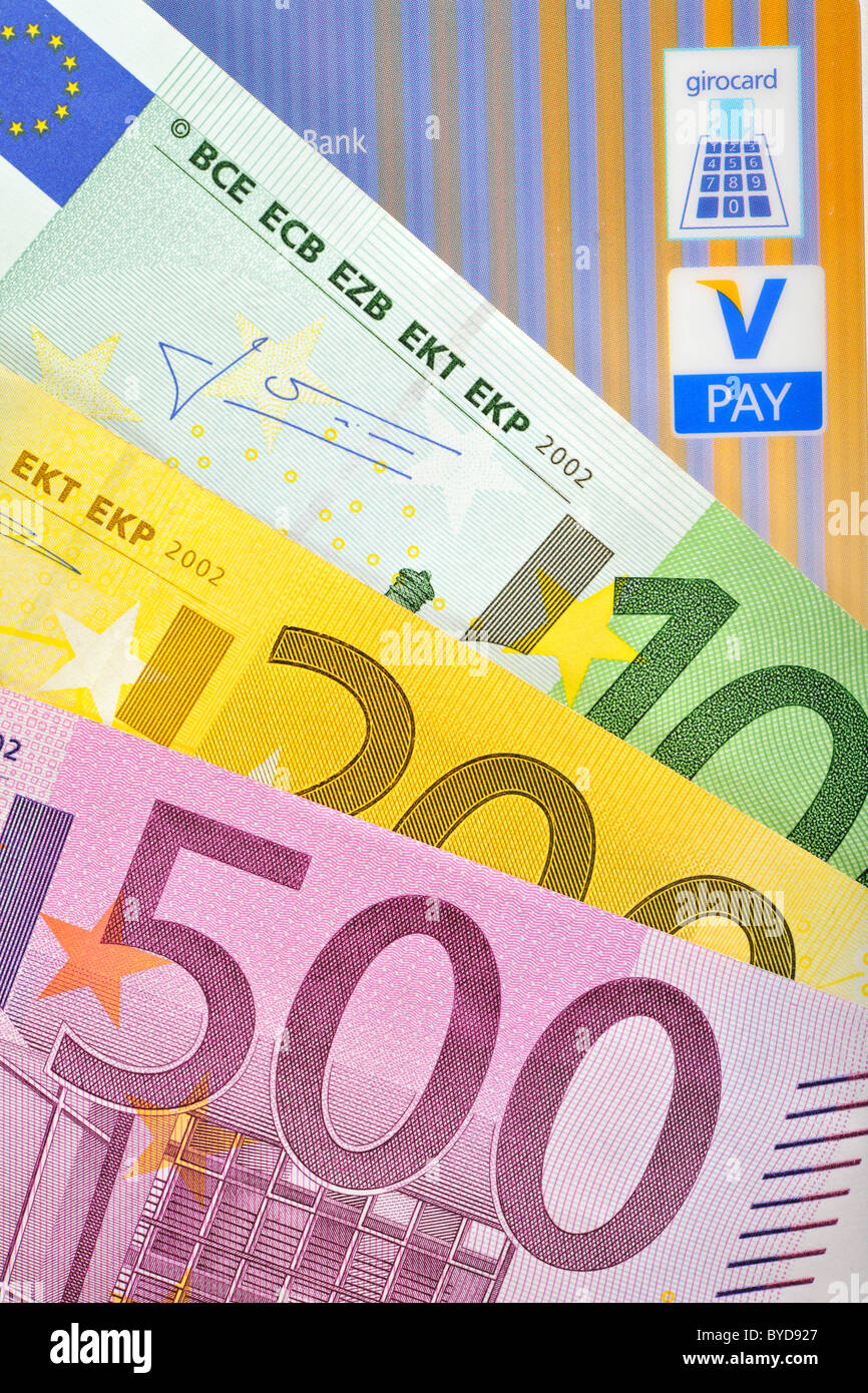 Euro banknotes, bills fanned out, bank card, cash card with the latest icons, V-PAY, VPAY, girocard Stock Photo