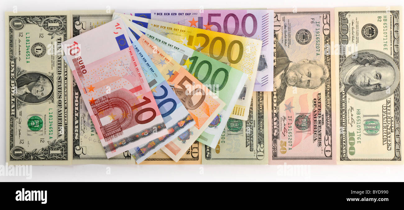 Symbolic image for exchange rate, U.S. dollar banknotes, euro banknotes fanned out Stock Photo