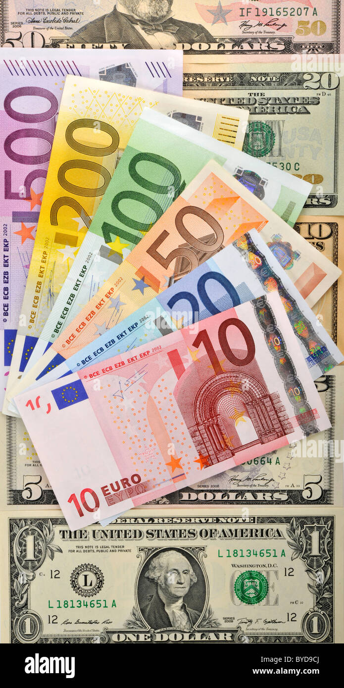 Symbolic image for exchange rate, U.S. dollar banknotes, euro banknotes fanned out Stock Photo