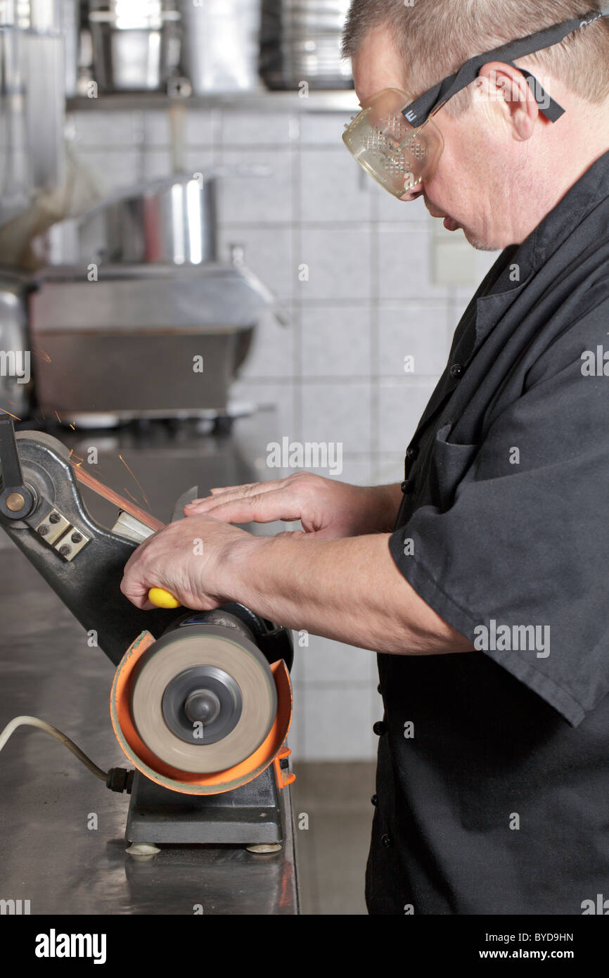 Closeup man hands sharpen knife on whetstone sharpener or grindstone.  Concept, maintenance tools for cooking, make knife sharp ,not dull for long  live using. Original style. 17158382 Stock Photo at Vecteezy