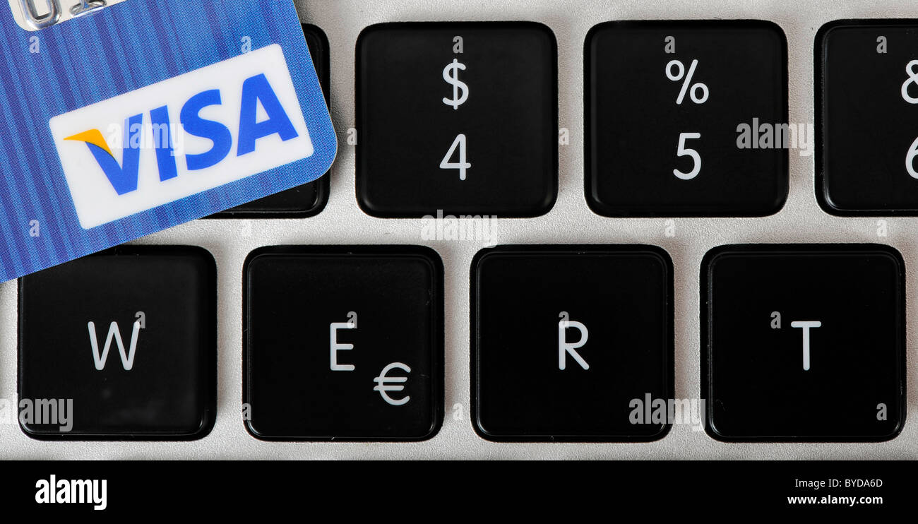 The letters WERT, German for value, with a VISA credit card on the keyboard of a laptop, PC, symbolic image for Internet Stock Photo