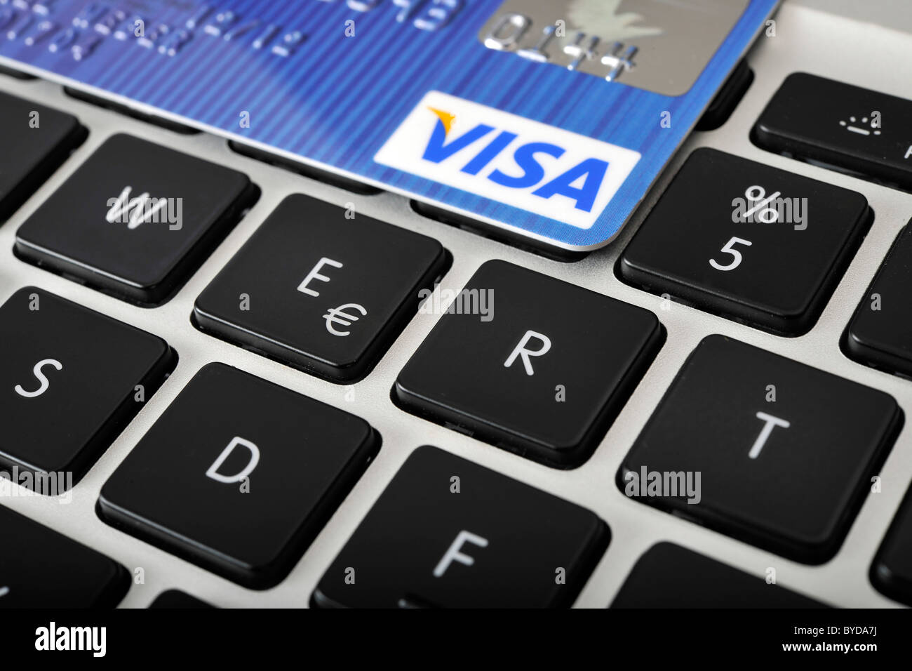 The letters WERT, German for value, with a VISA credit card on the keyboard of a laptop, PC, symbolic image for Internet Stock Photo