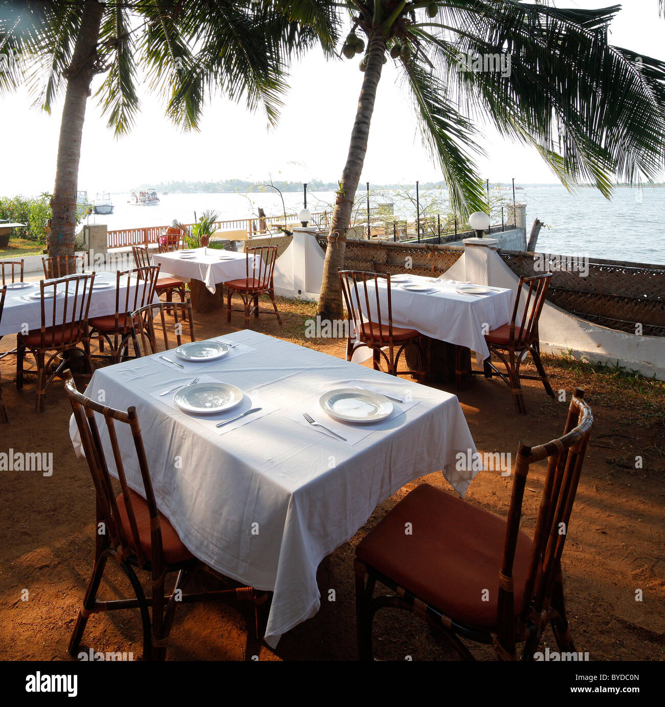 Set table, patio on the Indian ocean, palm trees, luxury hotel, Forthouse Hotel, Fort Cochin Kochi, Harbour Hotel, India, Asia Stock Photo