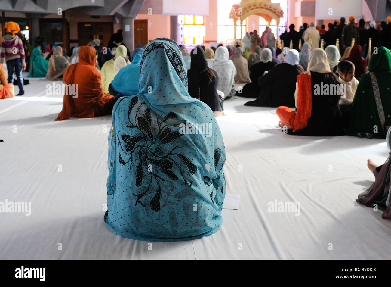 women praying at Havelock Road Gurdwara Southall Middlesex Stock Photo