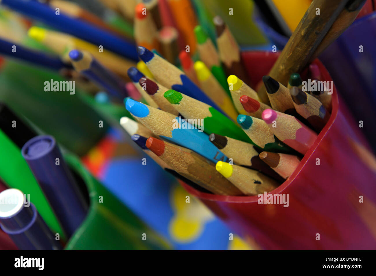 Pot of coloured crayons Stock Photo