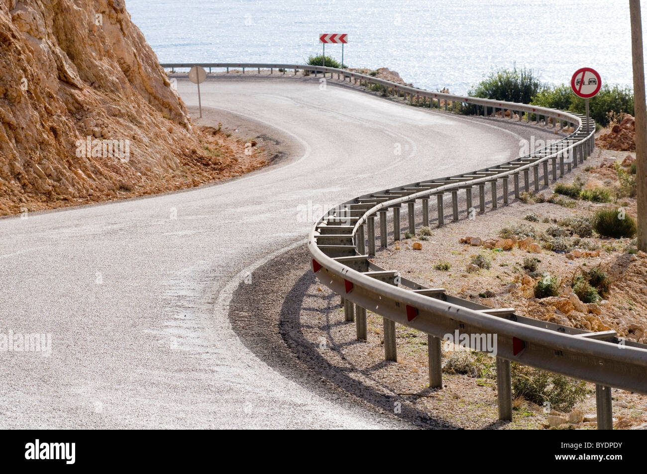long a winding road curves curved road curve coast  coastal roads sweeping bends bend fast quick driving thrill of the open armc Stock Photo
