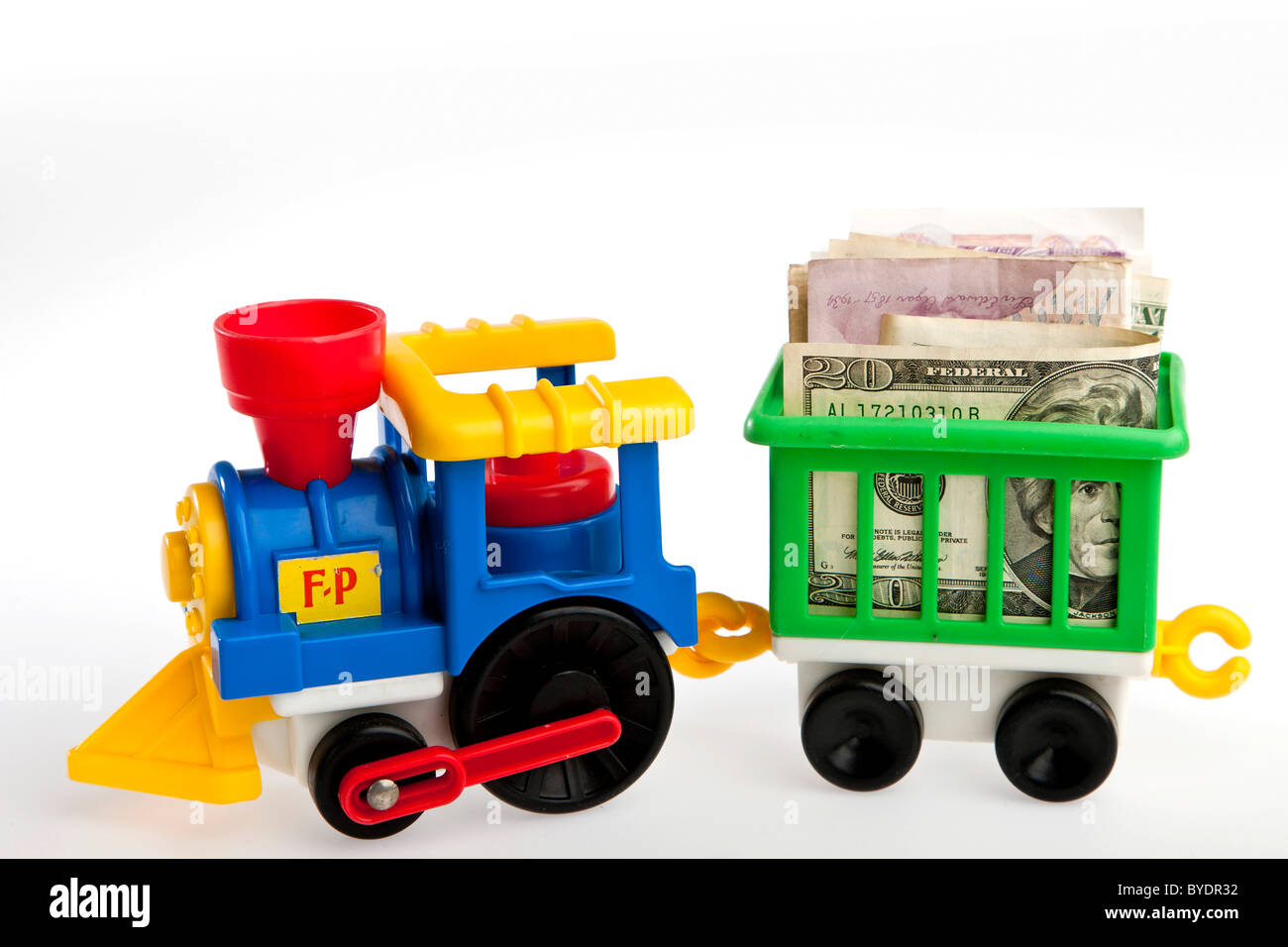 Toy train transporting bank notes Stock Photo