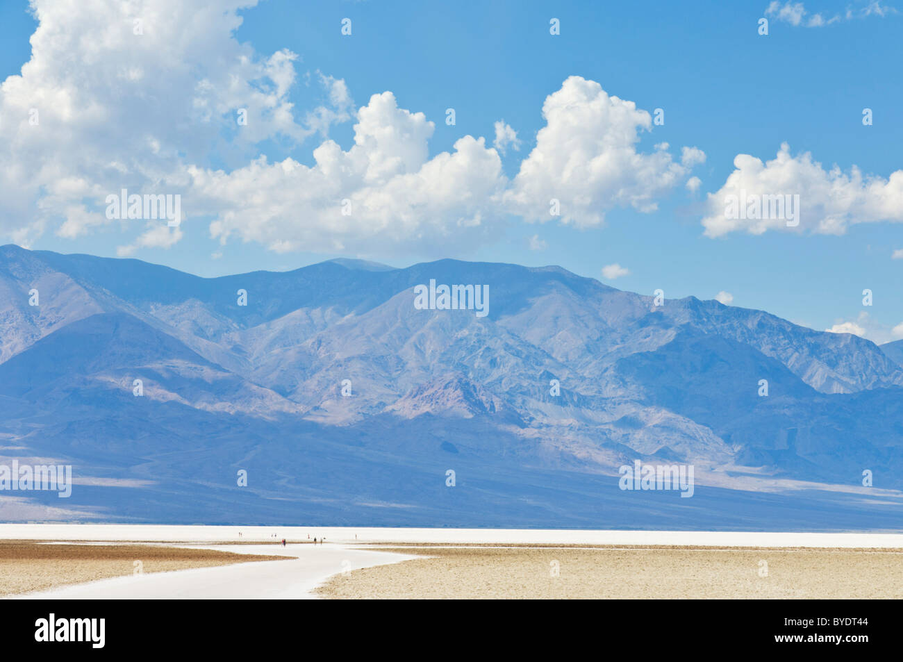 Tourists Walking onto the Salt pan polygons at Badwater Basin Death Valley National Park, California, USA Stock Photo