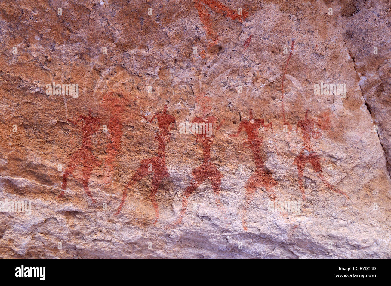 Historic painting of running or dancing people, neolithic rock art of ...