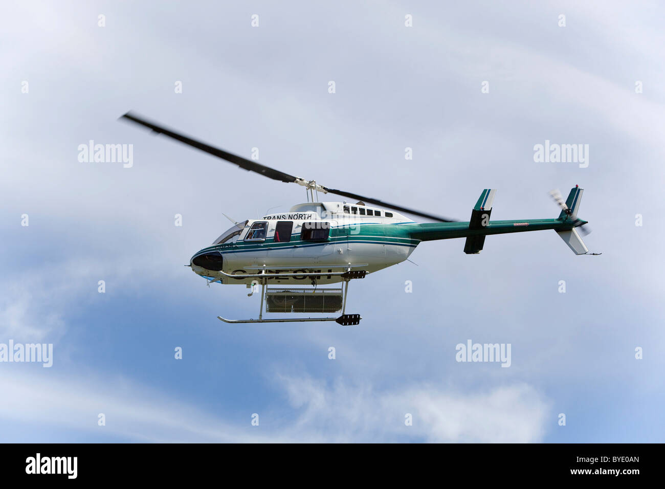 Helicopter Bell 206L4 Long Ranger in flight, operated by Trans North, Yukon Territory, Canada Stock Photo