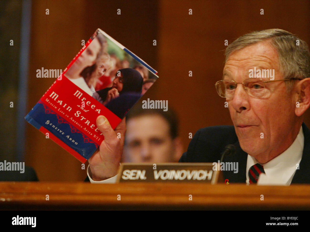 Senator George V. Voinovich (R-OH) displays a book he says touches on the concerns about the radicalization of Islam in America Stock Photo