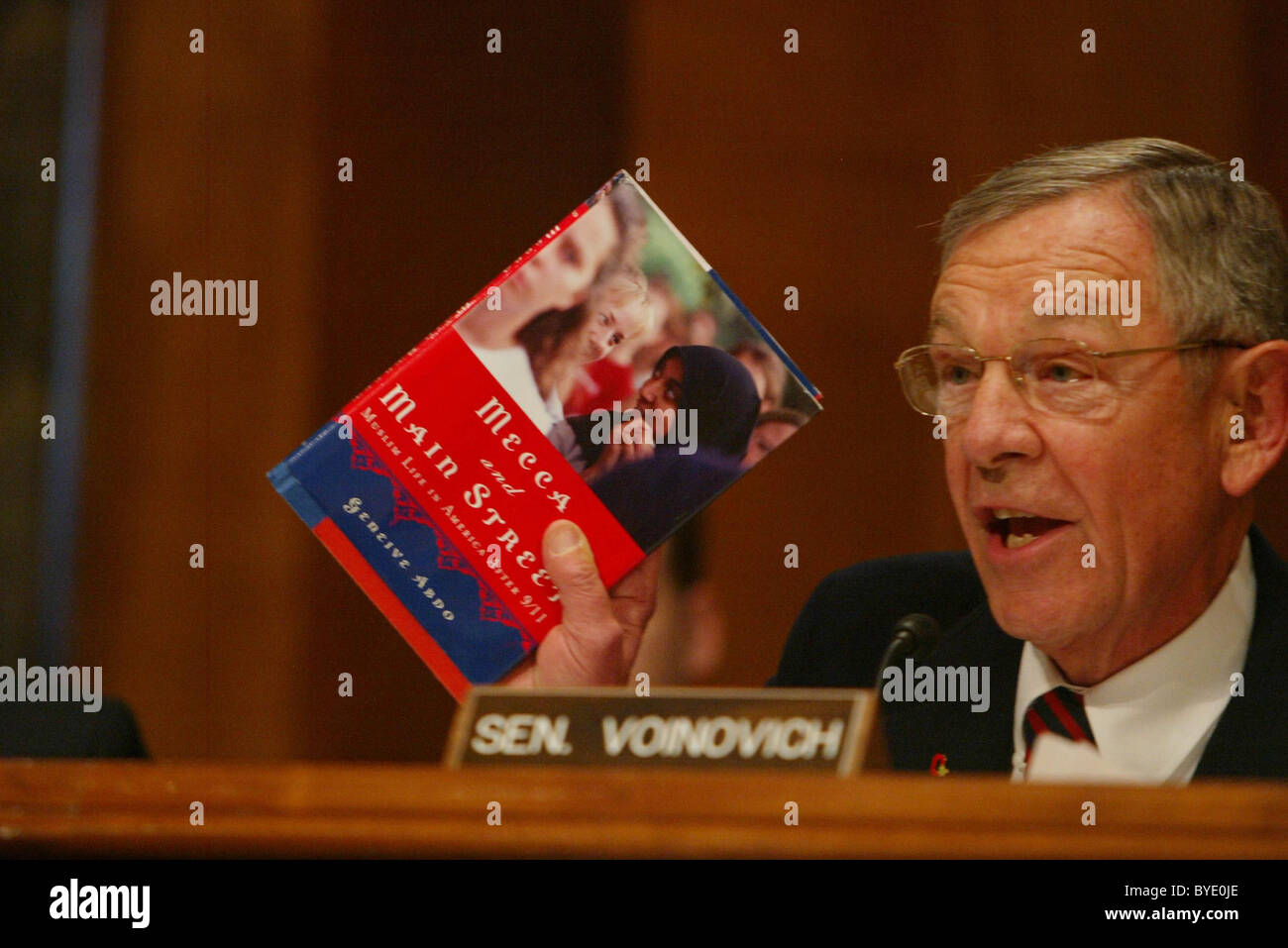 Senator George V. Voinovich (R-OH) displays a book he says touches on the concerns about the radicalization of Islam in America Stock Photo