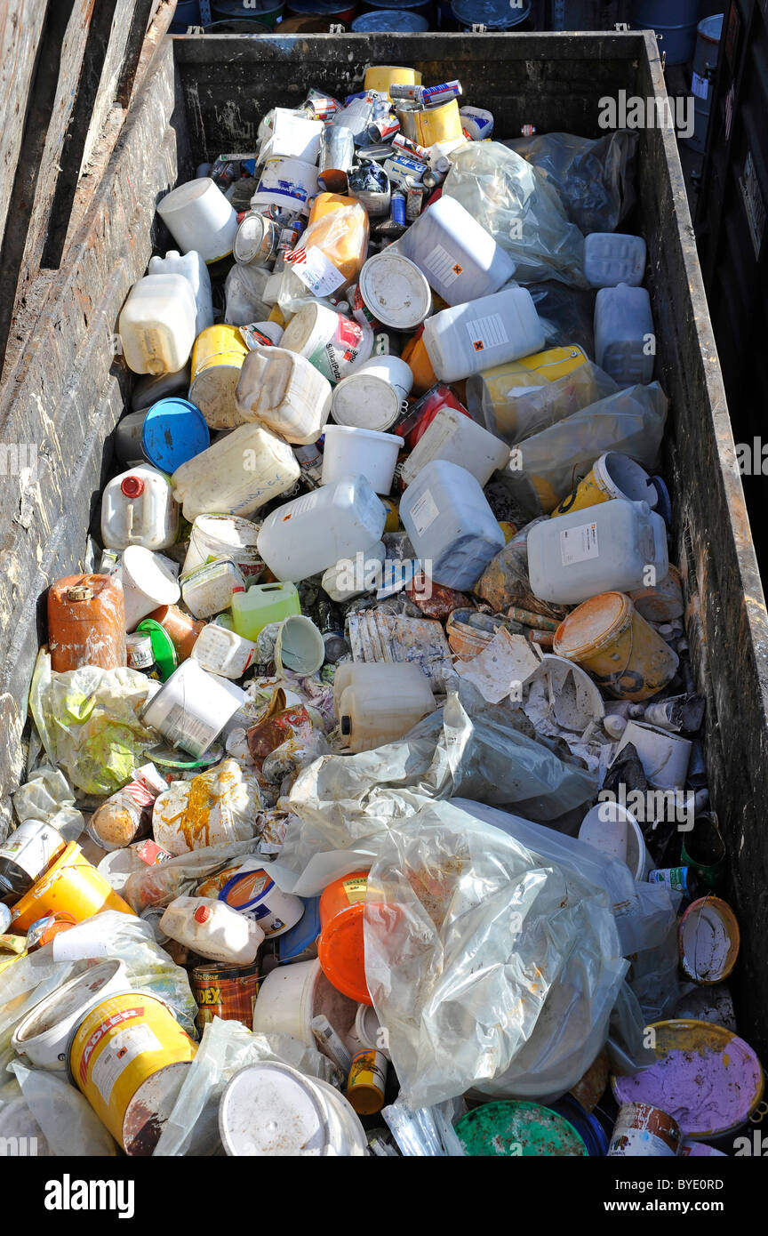 Paint cans and buckets, garbage in a collection container Stock Photo