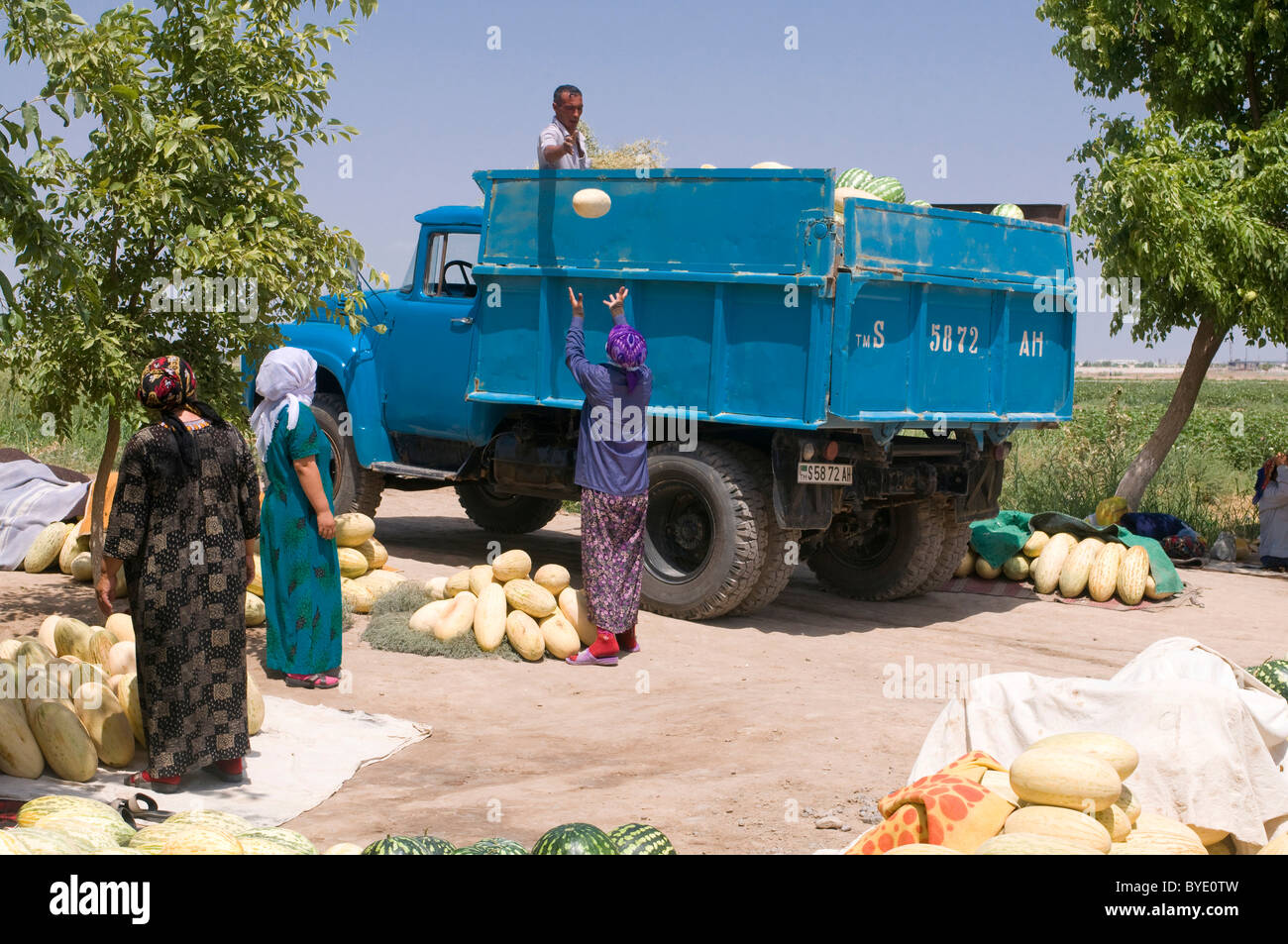 People transporting melons and other fruits, Turkmenistan, Central Asia Stock Photo