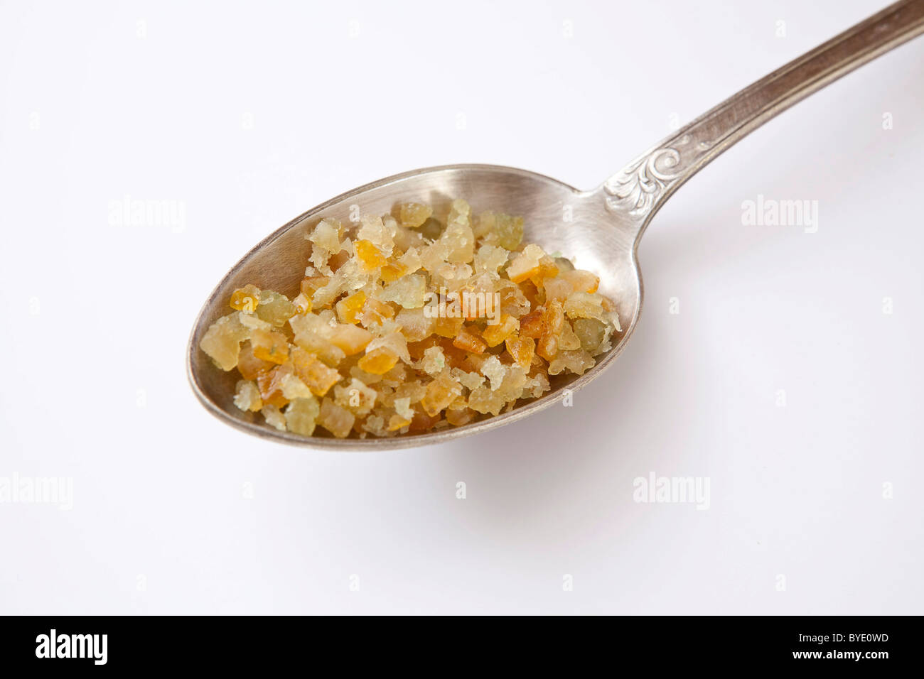 Candied lemon and orange peel, old silver spoon Stock Photo