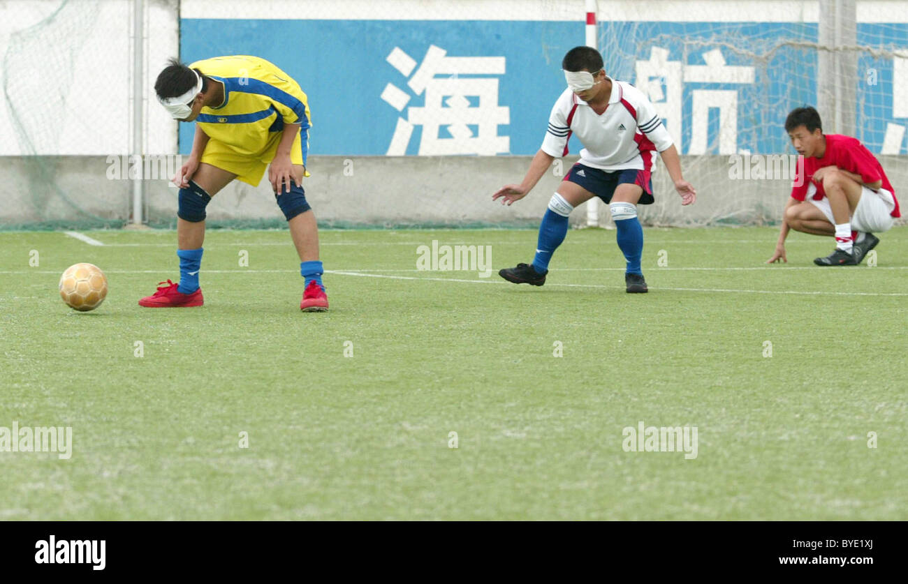 BLIND FOOTBALL This football team is made up of blind boys who play with a special ball in which