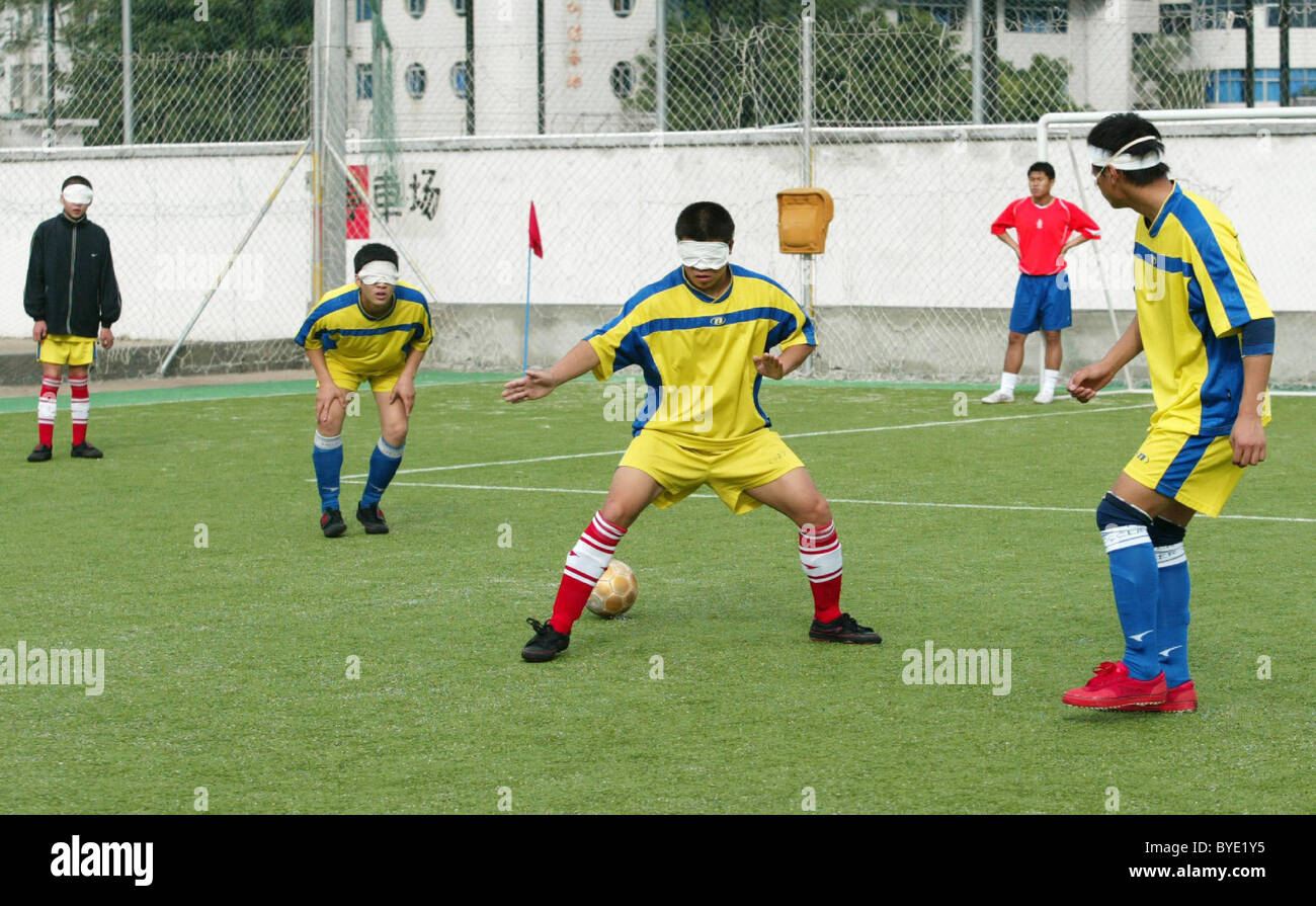 BLIND FOOTBALL This football team is made up of blind boys who play with a special ball in which