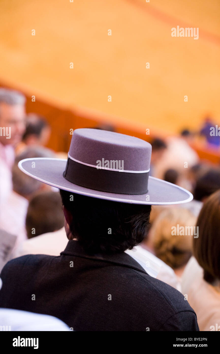 Sun / Spanish Gaucho hat worn by audience member / crowd / spectators /  spectator at Sevilla bullring / bull ring. Seville Spain Stock Photo - Alamy