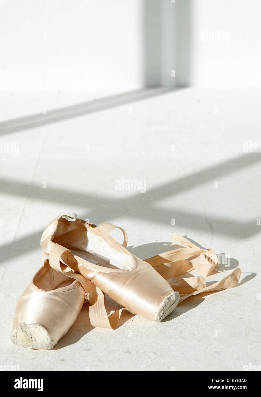Ballet shoes in a white room Stock Photo