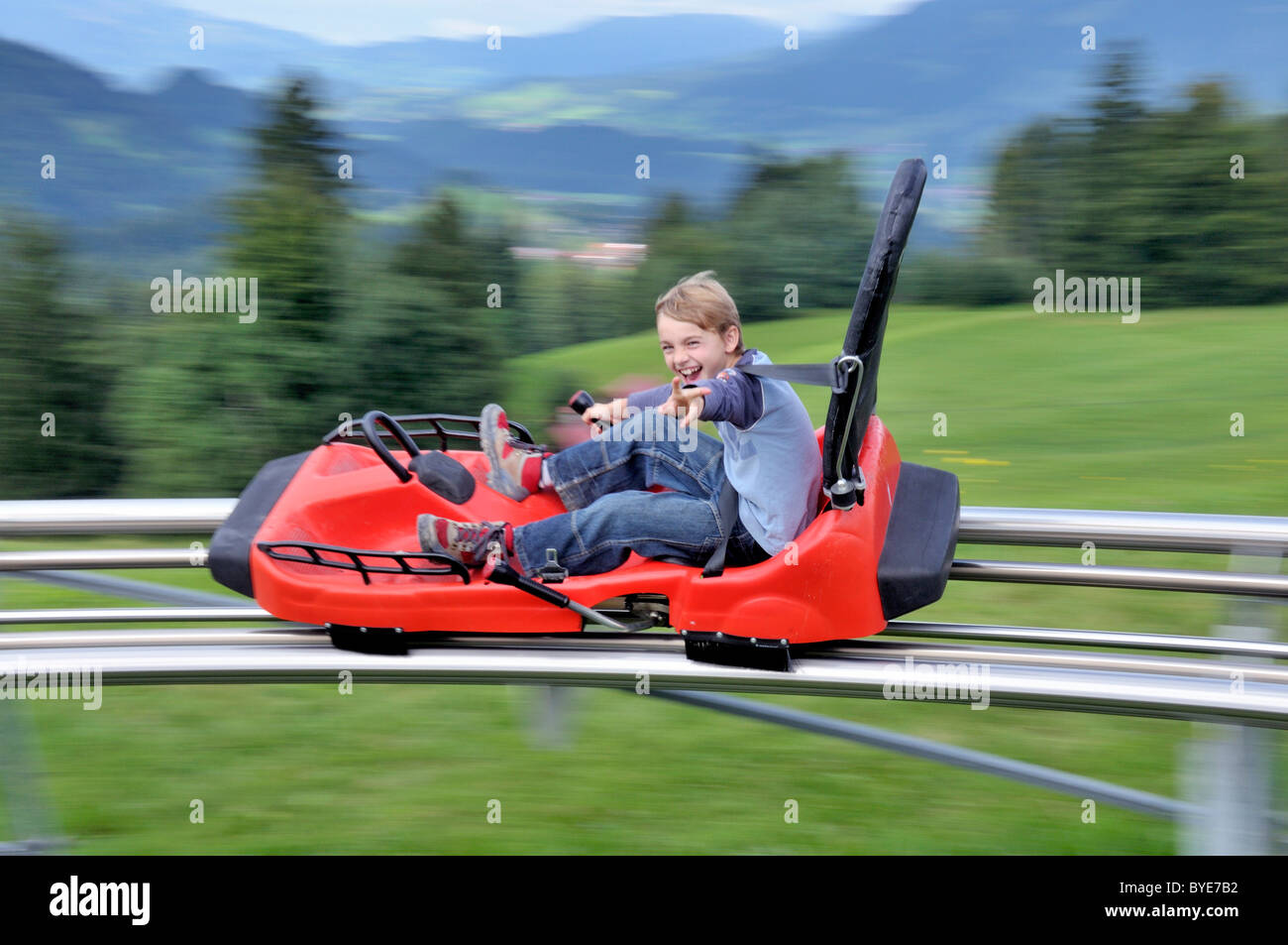 Boy enjoying himself on a summer toboggan run, SoellereckRodel