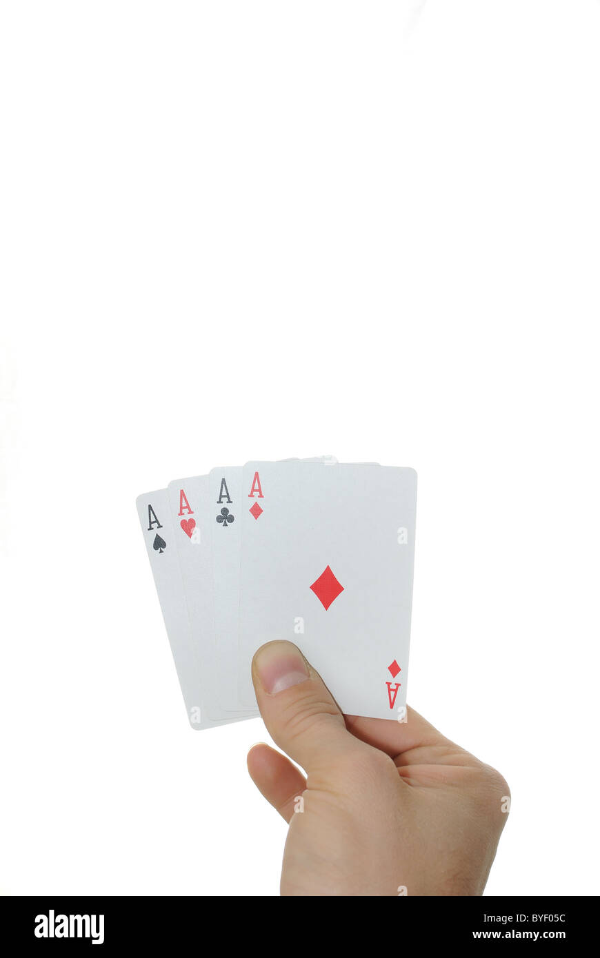 Four aces in a hand isolated on a white background. Stock Photo